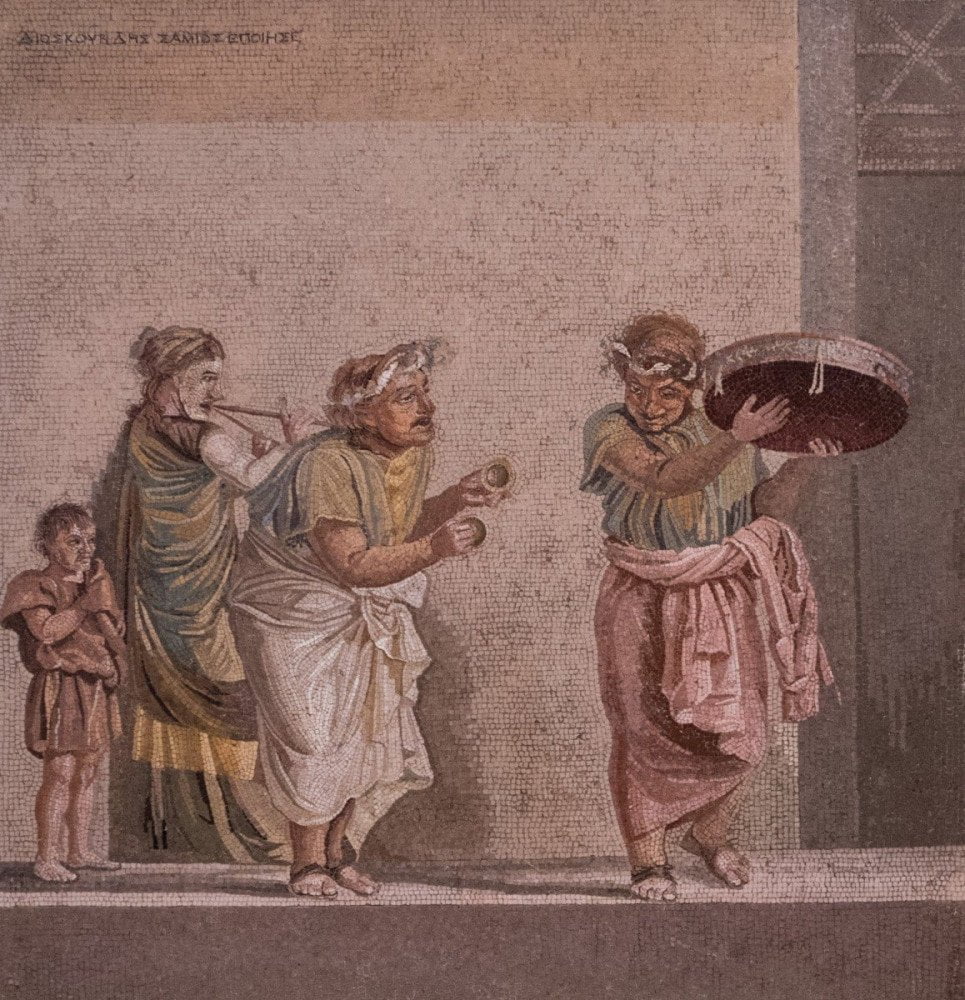 Mosaico di Pompei raffigurante persone intente a suonare e ballare